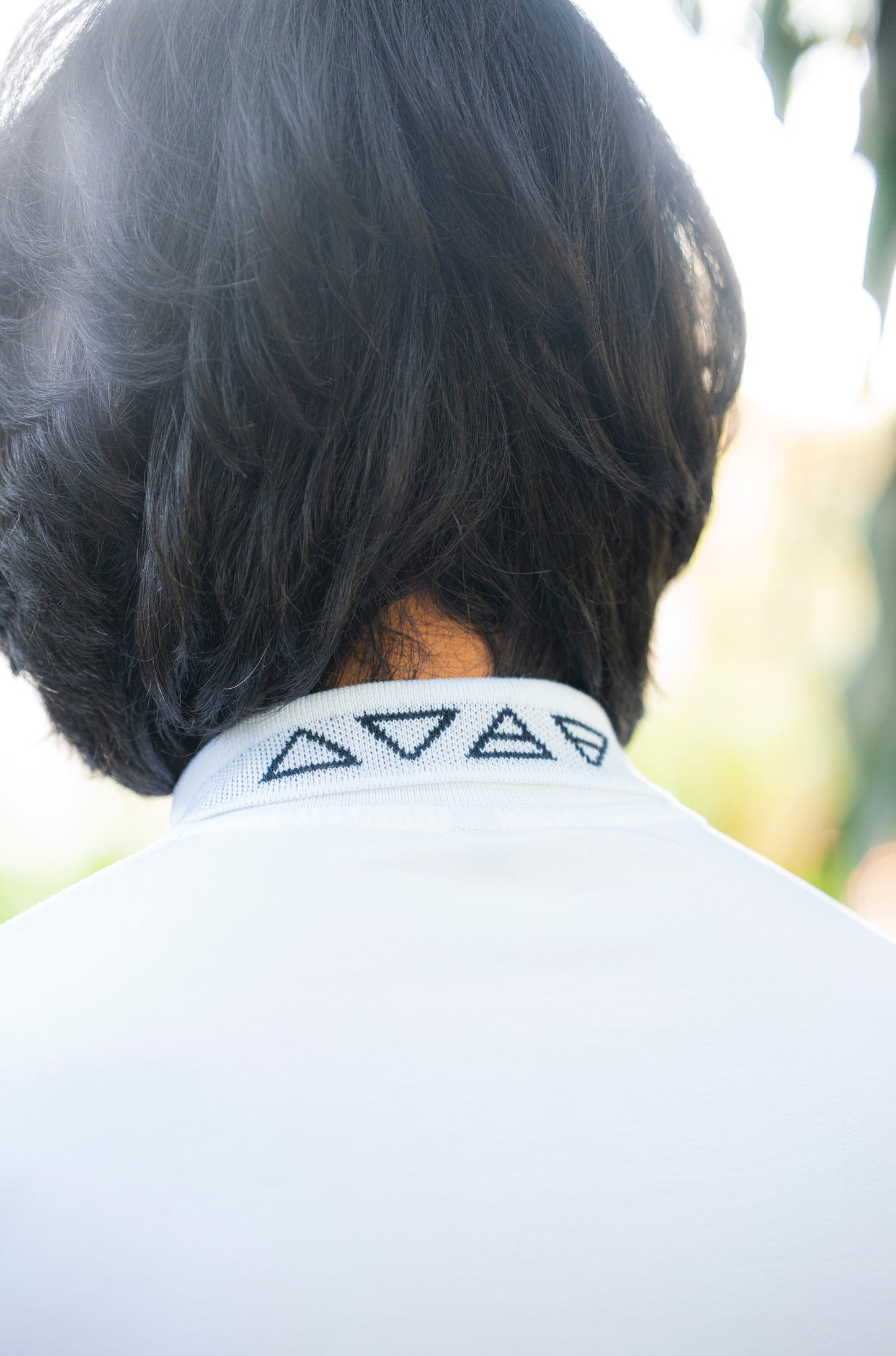 Contrast Oversized polo with unique collar branding